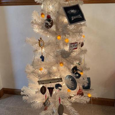 LOT 174D: Eagles Christmas Collection - White 42” Tree w/ Football Or aments, Snowglobe, Santa Hat & More