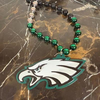 LOT 174D: Eagles Christmas Collection - White 42” Tree w/ Football Or aments, Snowglobe, Santa Hat & More