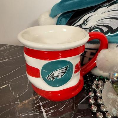 LOT 174D: Eagles Christmas Collection - White 42” Tree w/ Football Or aments, Snowglobe, Santa Hat & More