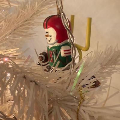 LOT 174D: Eagles Christmas Collection - White 42” Tree w/ Football Or aments, Snowglobe, Santa Hat & More
