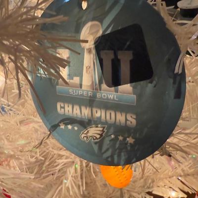 LOT 174D: Eagles Christmas Collection - White 42” Tree w/ Football Or aments, Snowglobe, Santa Hat & More