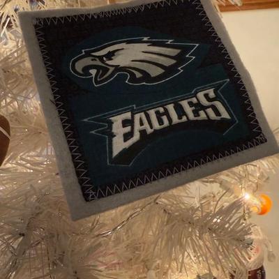 LOT 174D: Eagles Christmas Collection - White 42” Tree w/ Football Or aments, Snowglobe, Santa Hat & More