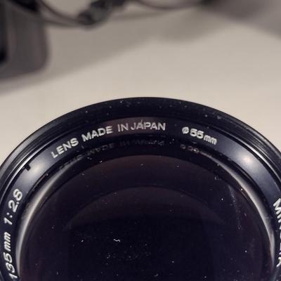 Minolta XG7 Camera with Celtic 135 mm 1:2.8 Lens, Auto 320 X Flash, and Carry Case