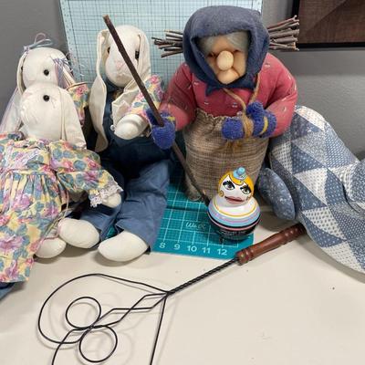 Stuffed rabbits, old lady and cat