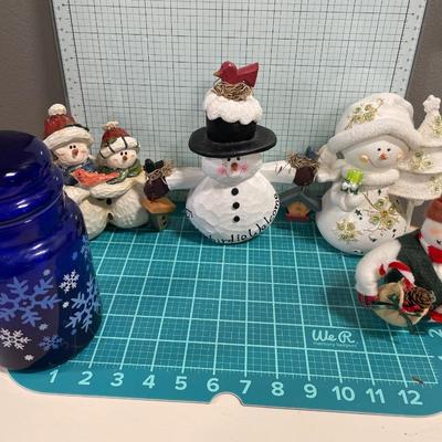 4 snowmen and a canister