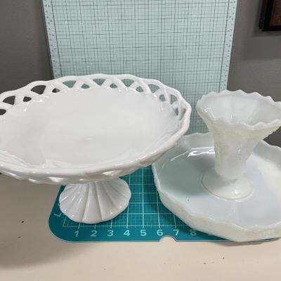 2 large white servers and blue glass vase