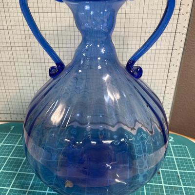2 large white servers and blue glass vase