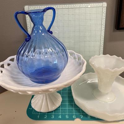 2 large white servers and blue glass vase