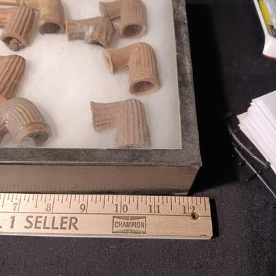 NATIVE AMERICAN PARTIALLY PIECES OF PEACE PIPES IN A DISPLAY CASE