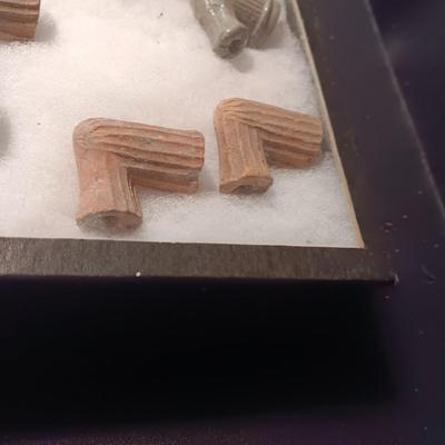 NATIVE AMERICAN PARTIALLY PIECES OF PEACE PIPES IN A DISPLAY CASE