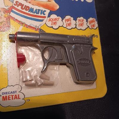 UNOPENED DIE-CAST SPUD-MATIC ON BOARD