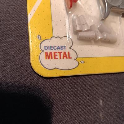 UNOPENED DIE-CAST SPUD-MATIC ON BOARD