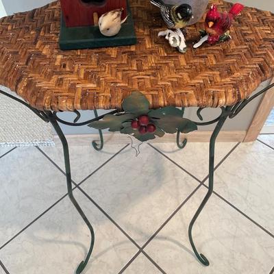Wicker table with bird house, birds and amaryllis