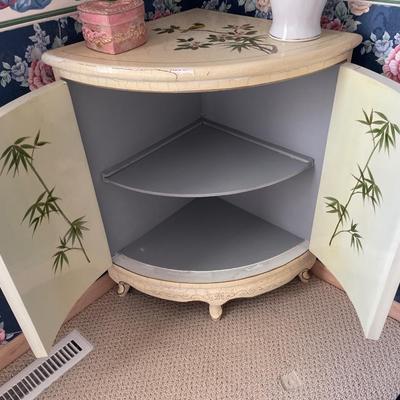 Painted bird corner cabinet