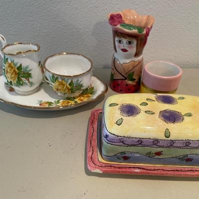 Yellow floral decor with butter dish and small Susan Pauley vase
