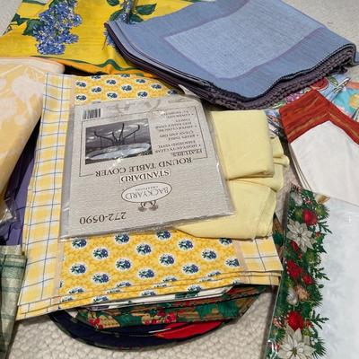 Large group of placemats and table clothes