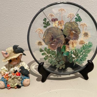 Pressed flowers and pig figurine