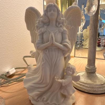 Angel decor with candle holders and lamp