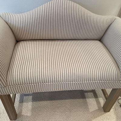 White and tan striped bench and two chairs