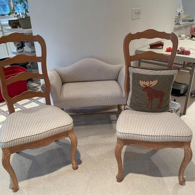 White and tan striped bench and two chairs