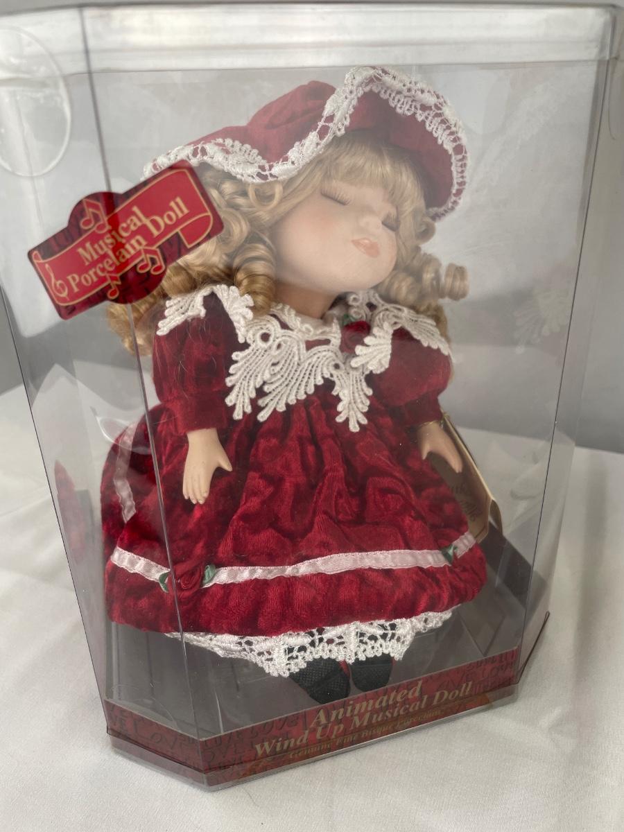 Animated wind up musical doll sale