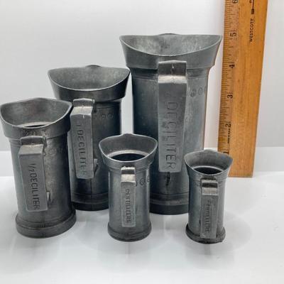 LOT 248: Vintage Dutch Pewter Measuring Cups, Metric System (Alphabet Themed) and Guide to American Pewter Book