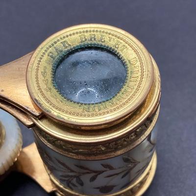LOT 252: Pair of Stunning Mother of Pearl Opera Glasses with Cases - French Par Brevet Dinvention and Swift Princess 25X Model No 726