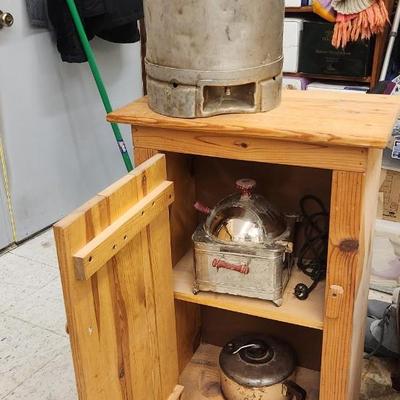 Cabinet complete with vintage popcorn makers and dairy can