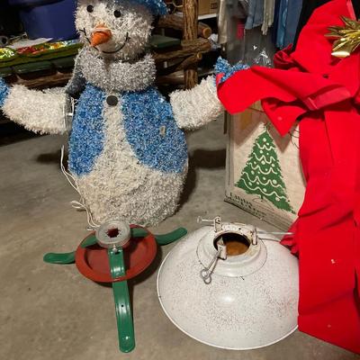 Lighted snowman and Christmas tree stands