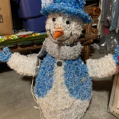 Lighted snowman and Christmas tree stands