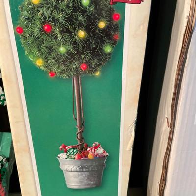 Advent calendar, lighted topiary, placemats, and table cloths