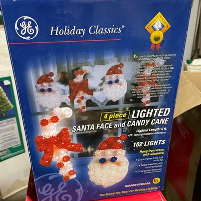 Outdoor lighted sculptures and animated doll