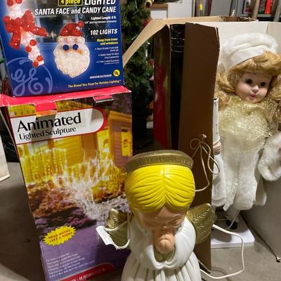 Outdoor lighted sculptures and animated doll