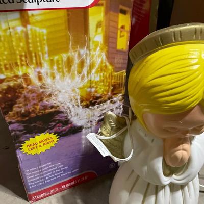 Outdoor lighted sculptures and animated doll