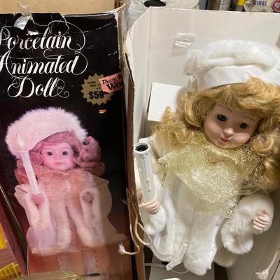 Outdoor lighted sculptures and animated doll