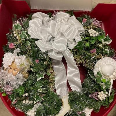 Lighted tinsel tree, wreath, and two wreath storage boxes