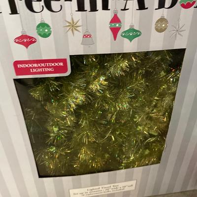 Lighted tinsel tree, wreath, and two wreath storage boxes