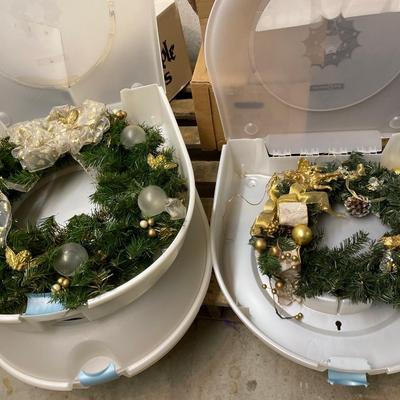 Three wreath storage boxes, and two wreaths