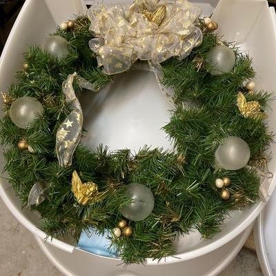 Three wreath storage boxes, and two wreaths