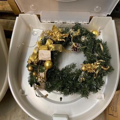 Three wreath storage boxes, and two wreaths