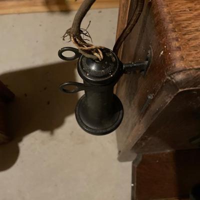 Antique hand crank wall phone with black bells