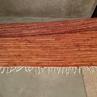 Red and cream woven rug