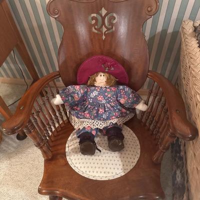 Wooden in unique pattern rocking chair with doll