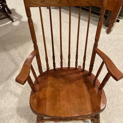 Brown wood rocking chair