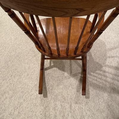 Brown wood rocking chair