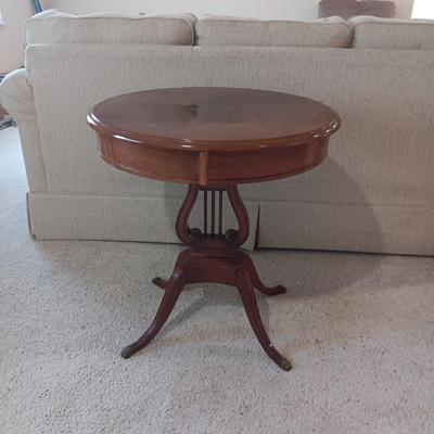 ANTIQUE MAHOGANY HARP TABLE W/BRASS CLAW FEET AND INLAID TOP