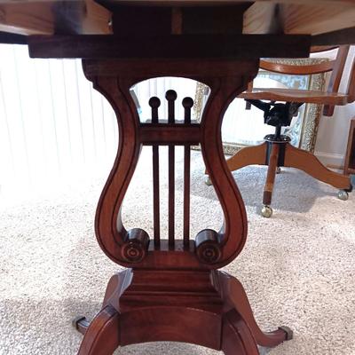 ANTIQUE MAHOGANY HARP TABLE W/BRASS CLAW FEET AND INLAID TOP