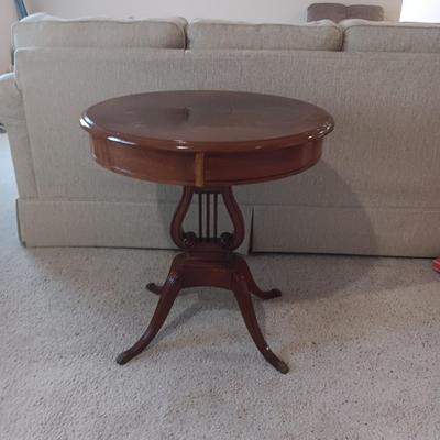 ANTIQUE MAHOGANY HARP TABLE W/BRASS CLAW FEET AND INLAID TOP