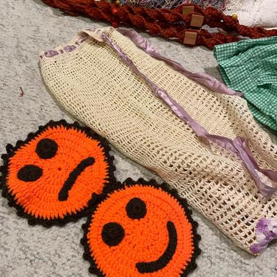 Vintage aprons, one macramé, plant hanger, and doilies