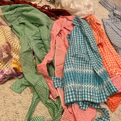 Vintage aprons, one macramé, plant hanger, and doilies